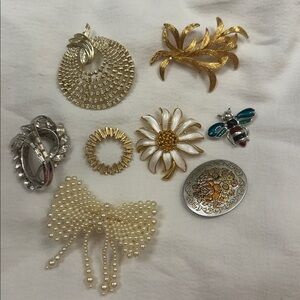 Elegant Gold and Silver Brooch Set including signed Trifari and Reed and Barton